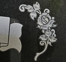 Detailed lily shape carving on polished granite