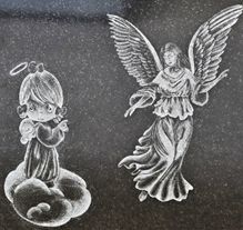 Sandblast carved mountain landscape on granite monument