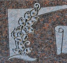 Sandblast carved religious scene on polished granite