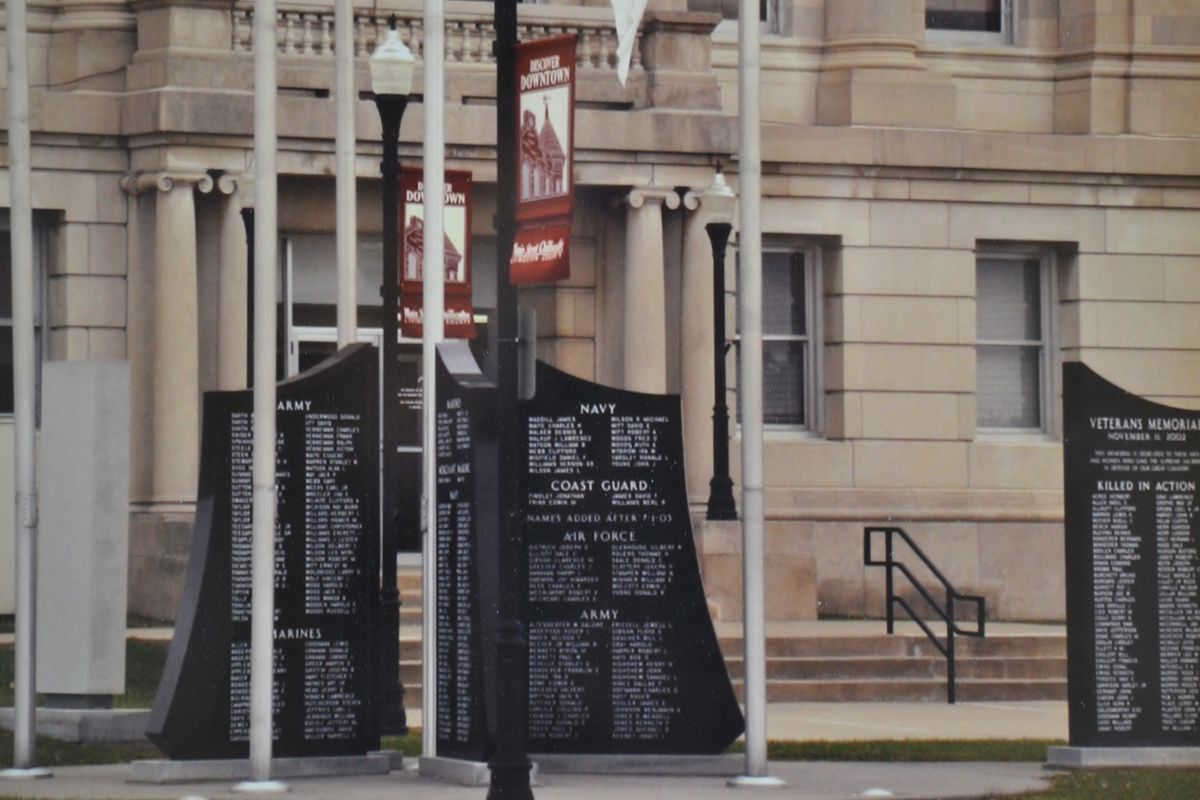 Custom memorial with scenic etching on dark granite